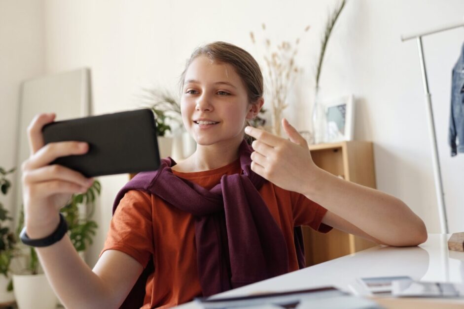 woman video chatting with friend during social distancing