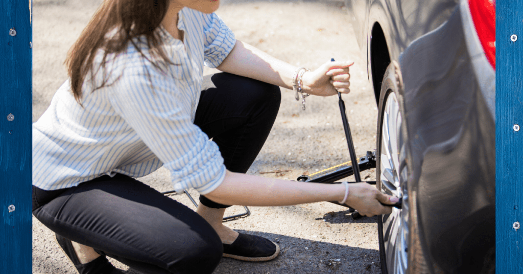 Changing a tire during a road trip