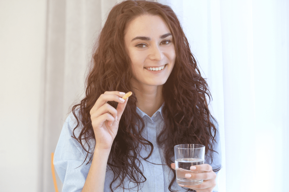 A woman taking health supplements